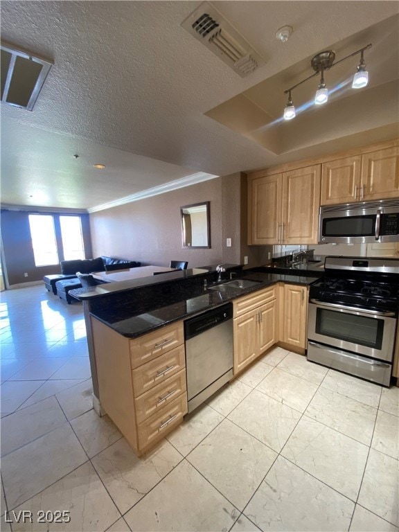 Kitchen with appliances with stainless steel finis