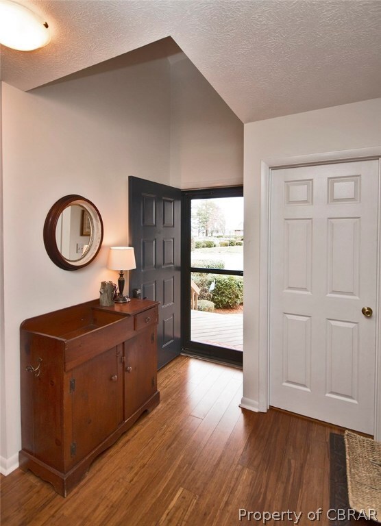Welcoming entry features a vaulted ceiling & new w