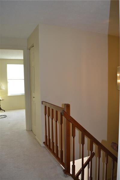 Upstairs hallway with linen closet.