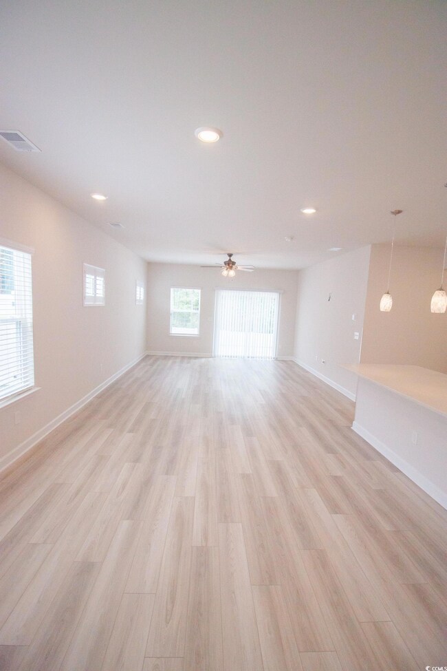 Unfurnished room featuring light wood-style flooring, baseboards, recessed lighting, and ceiling fan