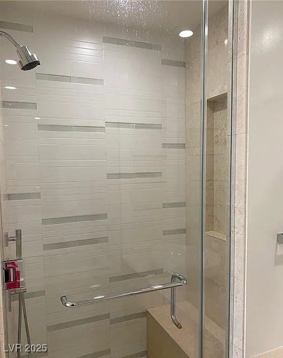 Full bathroom with a shower stall and a textured ceiling