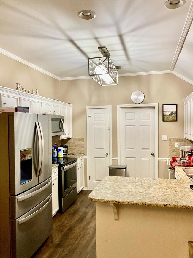 Kitchen featuring appliances with stainless steel 