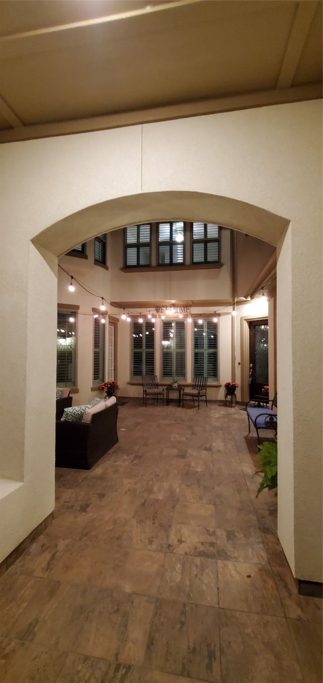 Night time view of the entrance to the courtyard.