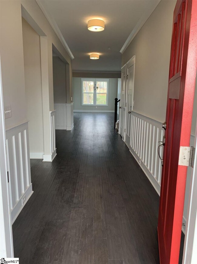 Front entry off of covered front porch offers soli