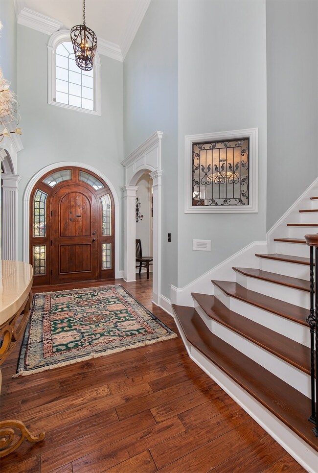 Such a warm and inviting foyer to welcome your guests. Hardwood floors throughout main level.