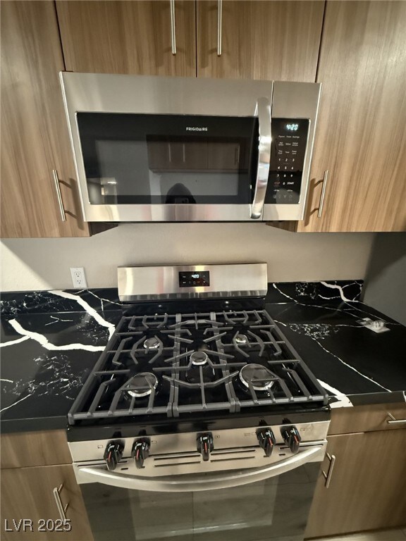 Room details featuring brown cabinets and stainles