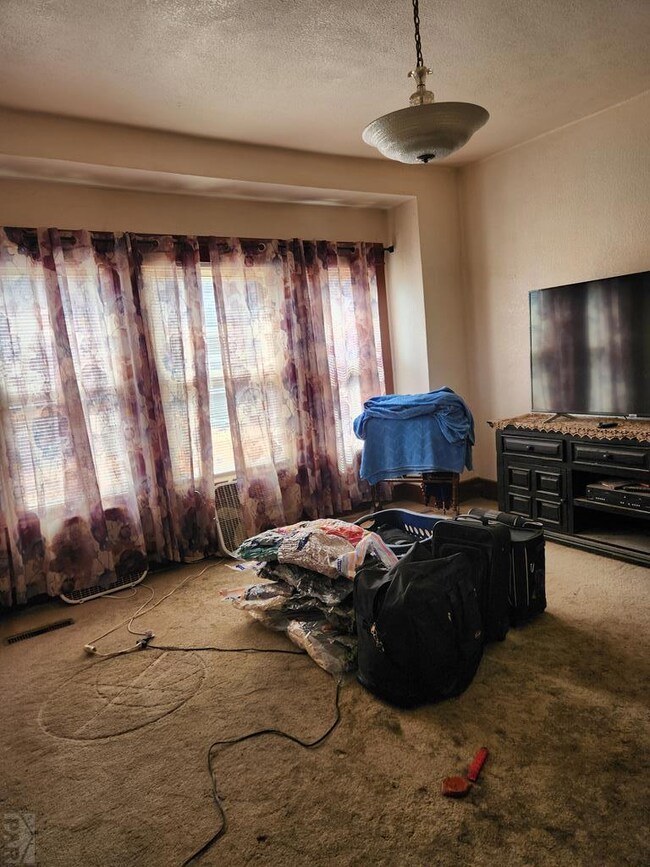 Living or dining room .Hardwood under carpet