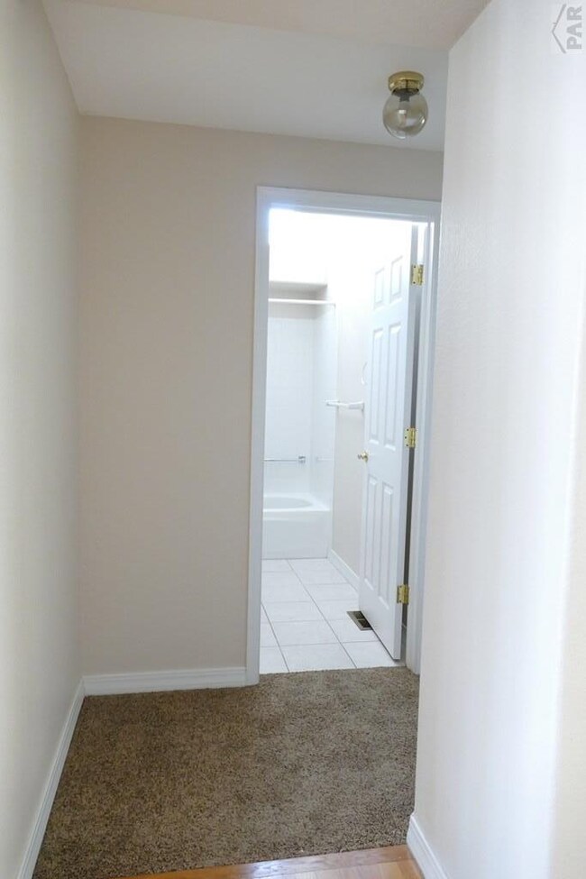 Hallway to guest bedroom/bathroom from foyer