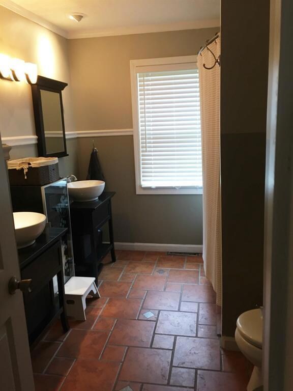 Remodeled bathroom with his and her...