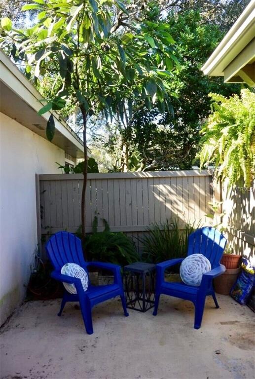 entrance from carport- private court yard, storage and gated