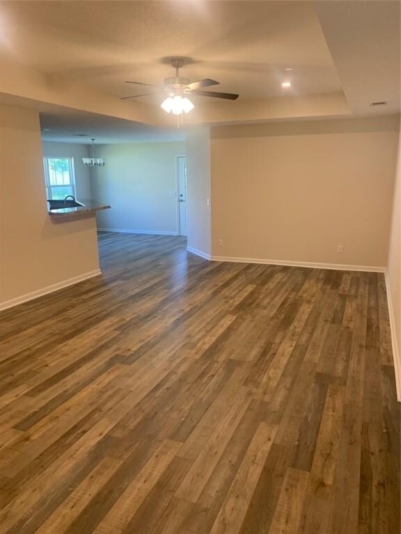 Living Room featuring trayed ceiling, recessed lig