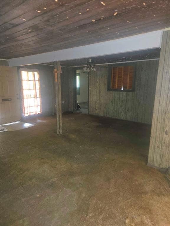 Below grade area with wood walls and wooden ceiling