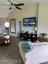 Living room with ceiling fan, hardwood / wood-styl