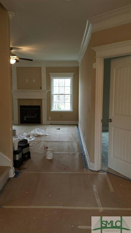 Large, open foyer with beautiful hardwood floors