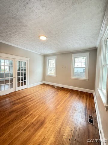 Unfurnished room with wood-type flooring, ornament