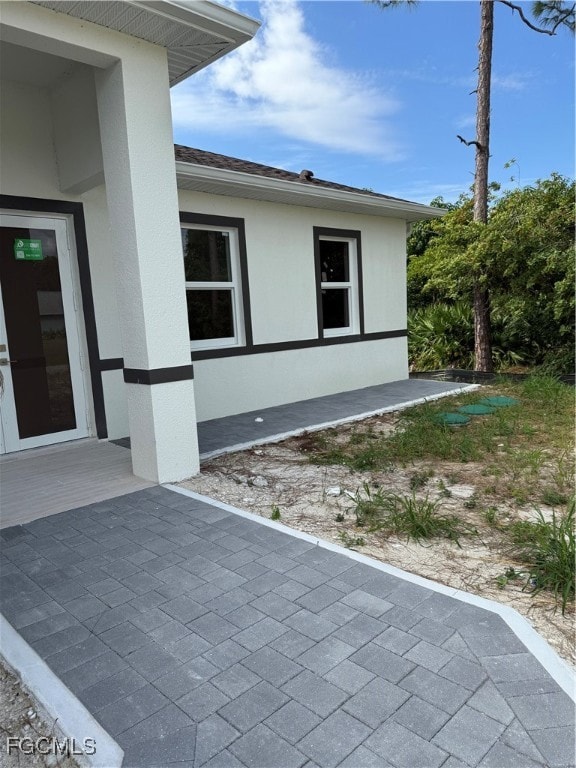 View of home's exterior featuring a patio area and stucco siding