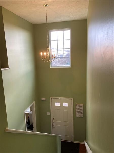 A soaring two story foyer greets you and guest to your new home.