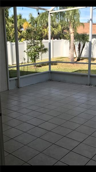 Screened in patio view of back garden