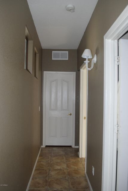 Hall to two bedrooms & bath left