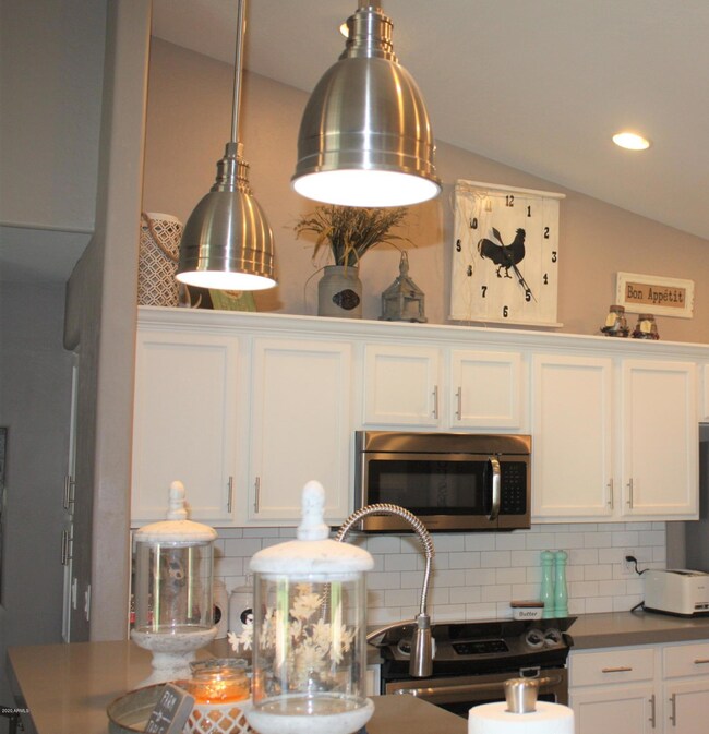 kitchen view 4 - stove and fridge wall