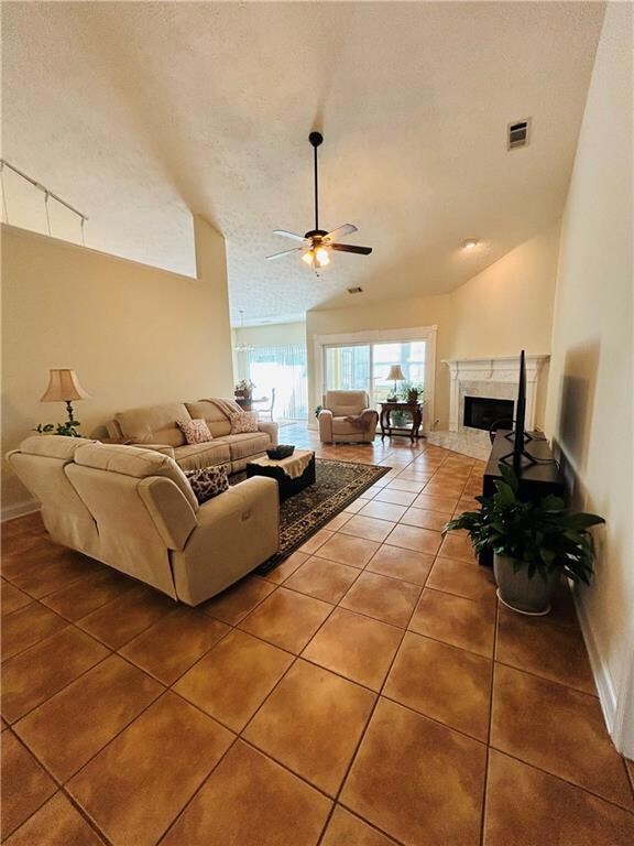 Living area featuring light tile patterned floors,