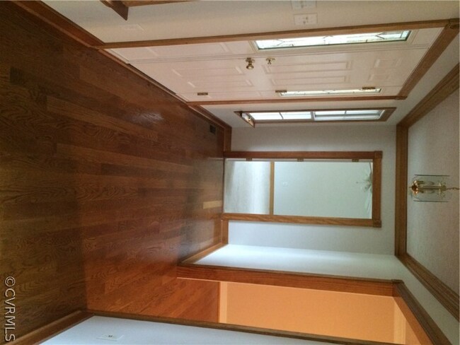 Elegant Entry Foyer 6x17, hardwood, upgrade natural trim and crown moldings.