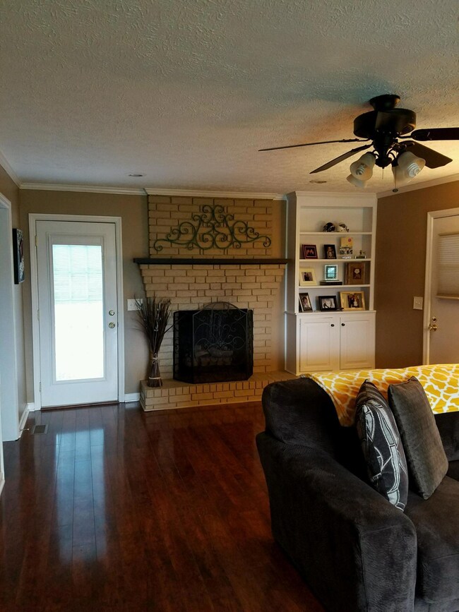 View of fireplace in living room