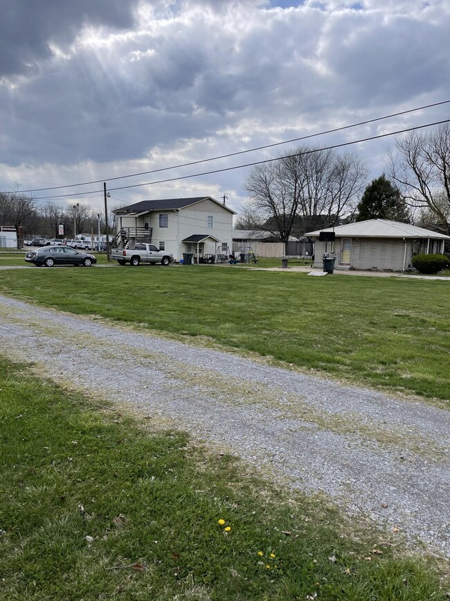 Side view of home and apartment building