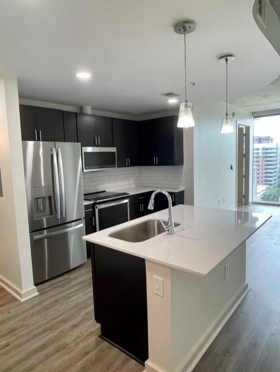 Kitchen featuring hanging light fixtures, light wo