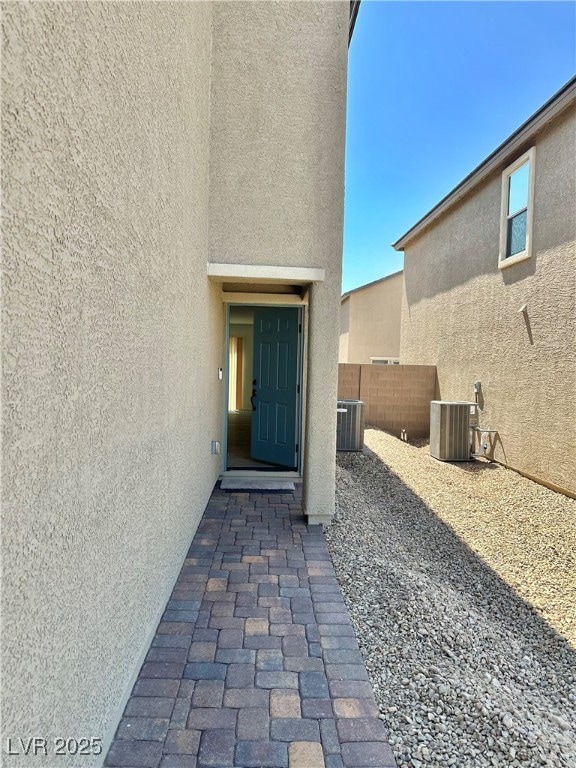 Property entrance with stucco siding