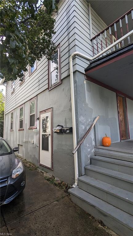 View of side of home with a balcony