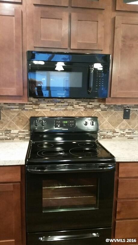 Upgraded appliances with flat top range with built
