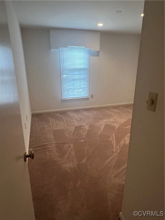 Unfurnished room featuring carpet