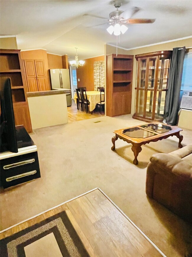 Living room opens up to kitchen dining area.