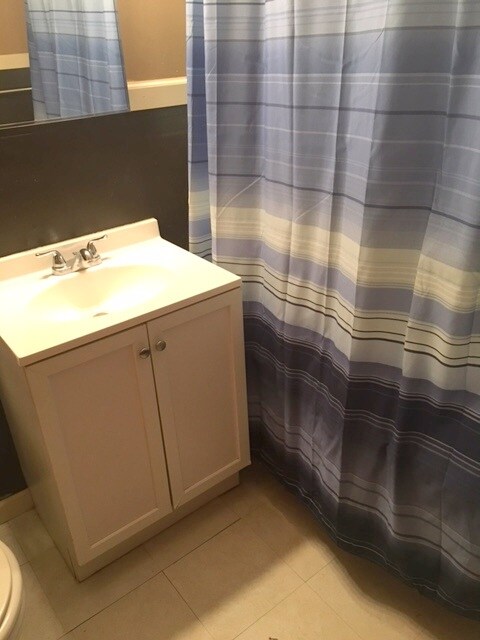 This bathroom has a claw foot tub which is part of