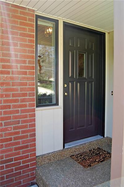 NEWER FRONT DOOR WITH SMALL COVERED PORCH
