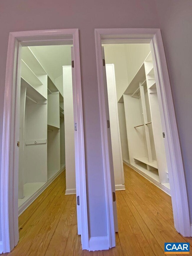 Two Walk-in Closets with Custom Shelving and Storage