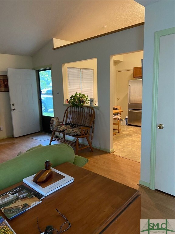 Living Room with Kitchen on right