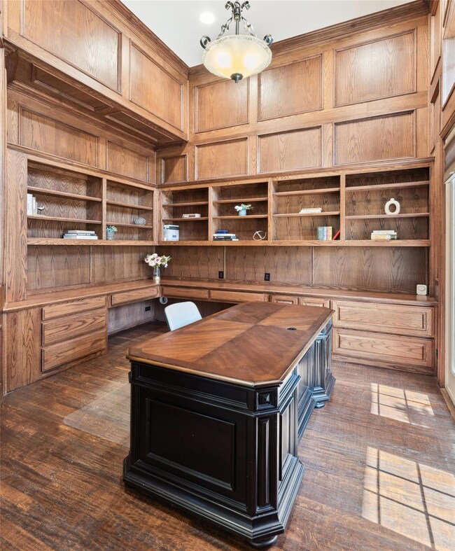 Home office with wooden walls, built in study area