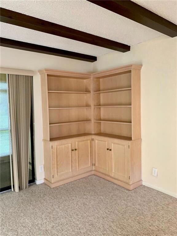 Built in bookcases in the living room corner.