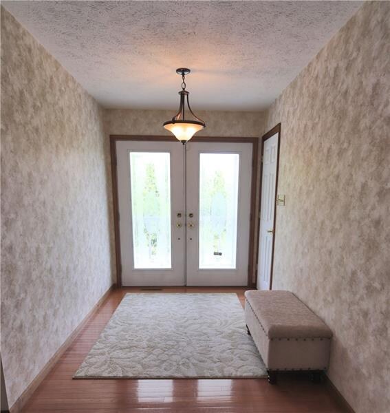 Open & inviting foyer with deep coat closet & hard