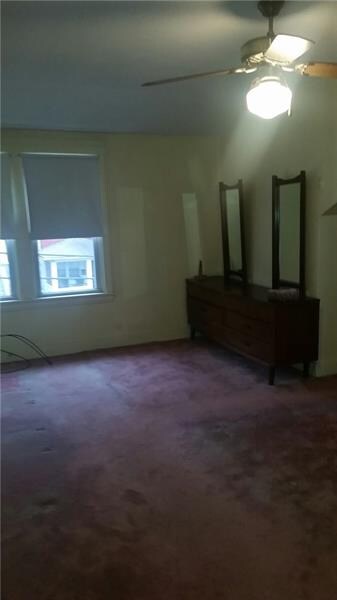 Large master bedroom with ceiling fan
