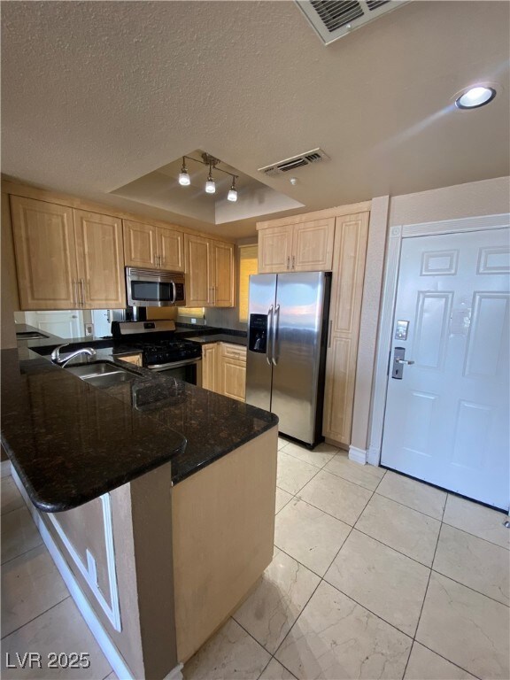 Kitchen with appliances with stainless steel finis