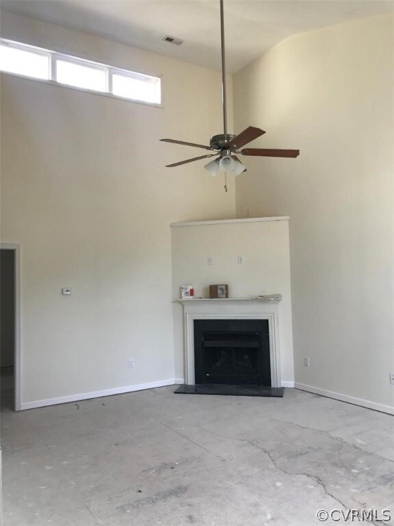 Great room showing fireplace and vaulted ceiling,