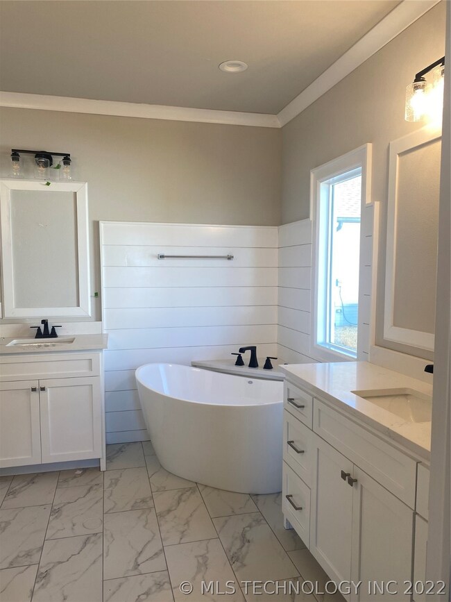 Master bath with soaker tub, separate vanities