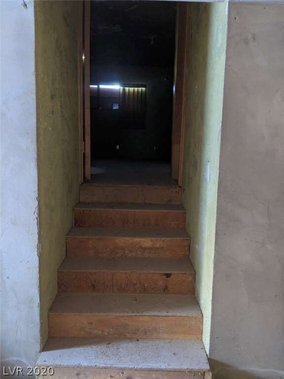 Stairs from entry to living room