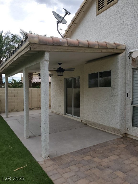 View of patio with ceiling fan
