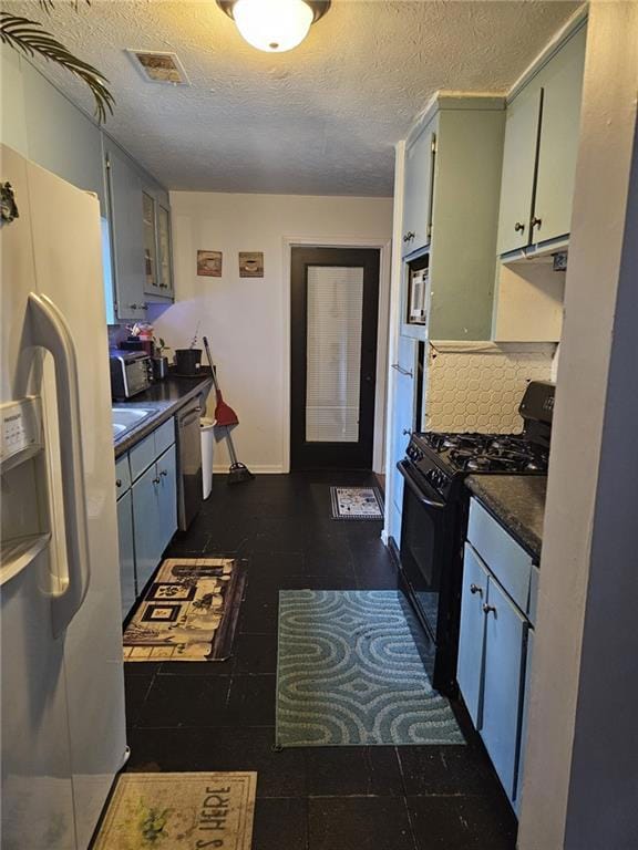 Kitchen with tasteful backsplash, dishwasher, black range with gas stovetop, white refrigerator with ice dispenser, and a textured ceiling