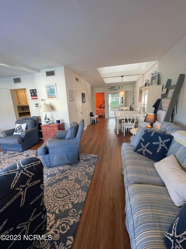 Living room looking toward kitchen and f