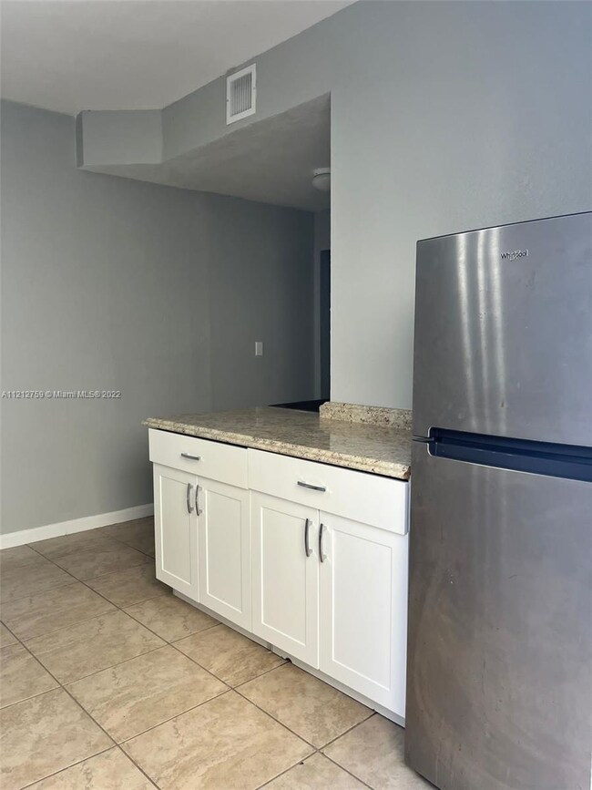 Kitchenette storage w/fridge